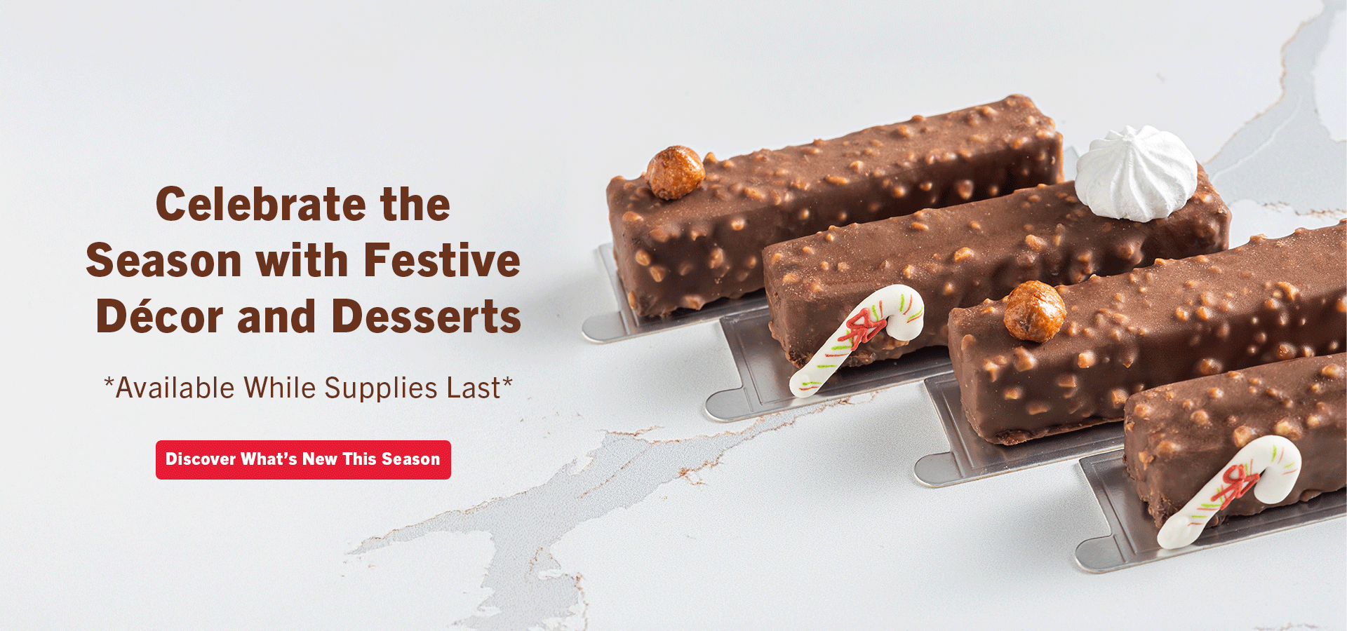 Chocolate enrobed hazelnut bars decorated with piped sugar candy canes